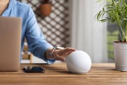 close up hand touching virtual assistant